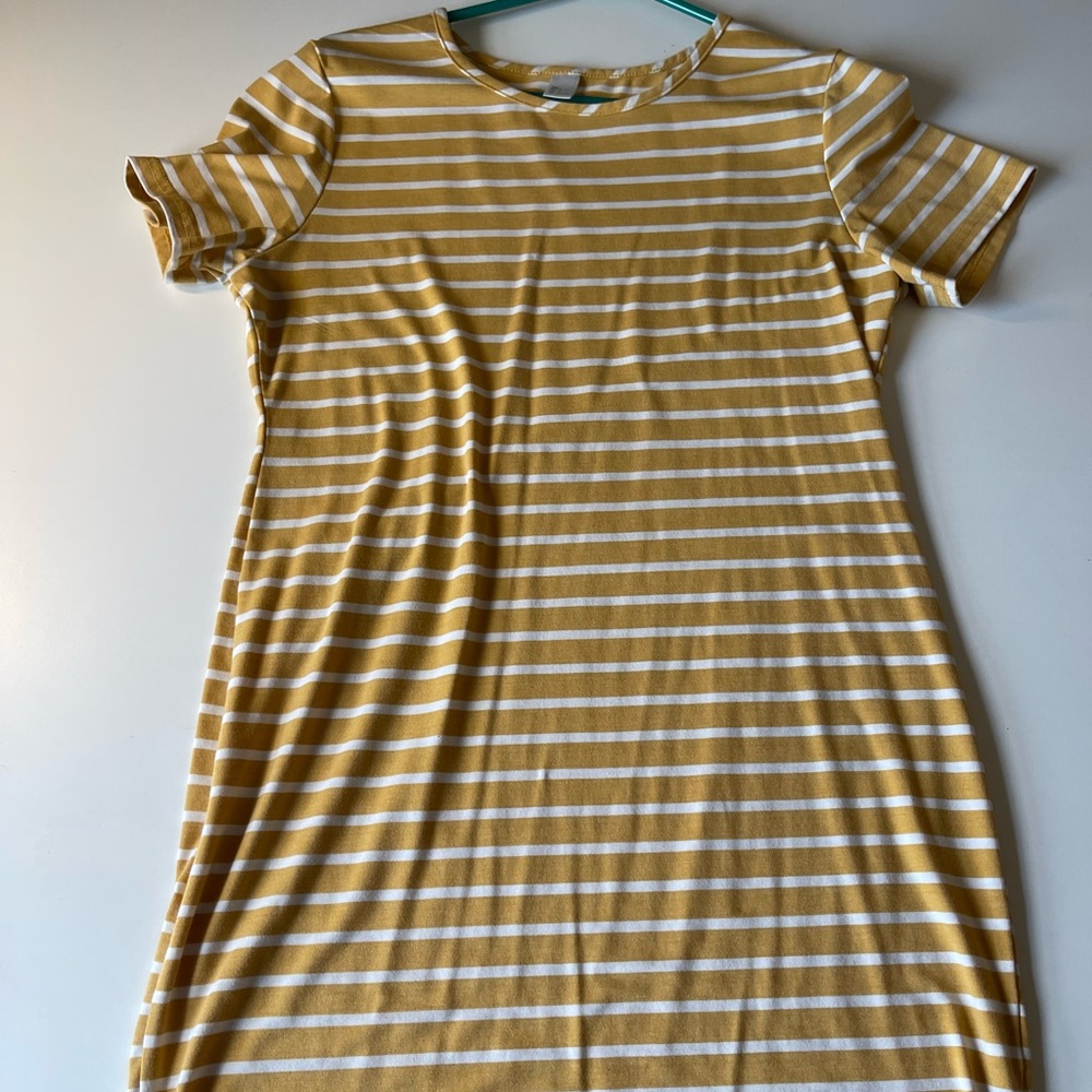 Yellow and white stripped sundress that goes to the knees, and it is a slim fit